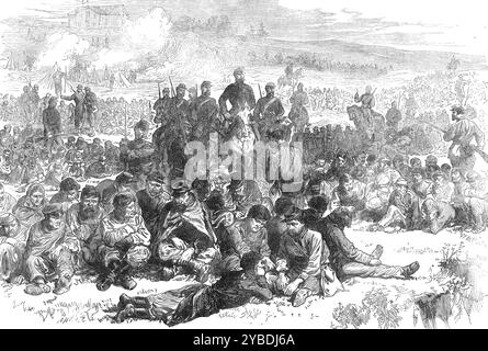 Die späten Ereignisse in Paris: Gefangene Aufständische von Belleville bewacht im Parc des Buttes Chaumont, 1871. „Die Gefangenen, die lebendig genommen wurden, wurden nach Zehntausenden gezählt...[unsere] Gravur repräsentiert diejenigen, die im Belleville-Viertel gefangen gehalten wurden, die im Park der Buttes Chaumont gefangen waren, mit einer Wachtwache von Soldaten, die über jede Gruppe von hockenden, entwaffneten Elenden gestellt wurden, die die ihnen zugewiesenen Plätze besetzten.“ Aus Illustrated London News, 1871. Stockfoto