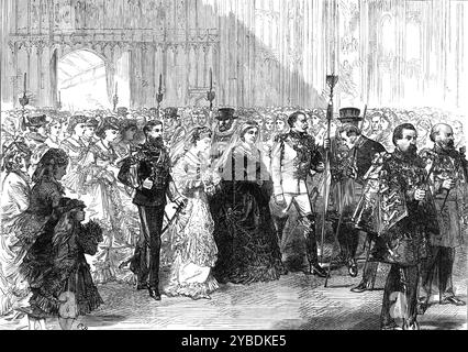 Heirat von Prinzessin Louise: Die Brautprozession in der St. George's Chapel, Windsor, 1871. Die Königin [Victoria] links von der Prinzessin trug ein schwarzes Satinkleid, mit Kragen und Jet bespannt, und ein Diadem aus Diamanten über einem langen weißen Tüllschleier. Ihre Majestät trug eine Rubin- und Diamantbrosche und -Halskette, mit einem Diamantkreuz, dem Band und Stern des Garterordens, den Orden von Victoria und Albert und Louise von Preußen sowie den Orden der Familie Sachsen-Coburg und Gotha. Das Hochzeitskleid von Prinzessin Louise war aus sattem weißem Satin, bedeckt mit einem tiefen Volant aus Spitze von Honiton Point, beschnitten Stockfoto