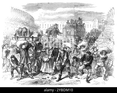 Die ersten Gemüsewagen vor den Toren von Paris, 1871 plündern. Deutsch-Französischer Krieg. Die Wagen der Marktgärtner, die ihre ersten Ladungen Kartoffeln, Kohl und anderes Gemüse nach Paris brachten, wurden in einigen Fällen von einigen ungeordneten Leuten geplündert. Dies geschah umso einfacher, als es eine Blockierung und Stilllegung der überfüllten Fahrzeuge im schmalen Pass zwischen den Erdwällen vor den Stadttoren gab. Herr Jules Pelcoq, unser Künstler in Paris, trägt eine Skizze eines solchen Vorfalls vor dem Tor auf der Straße nach St. Denis bei, wo der Raum durch Fo verengt wird Stockfoto