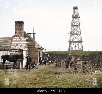 Ein Fotograf in der Wohnung steht mit seinem Pferd. Foto-Wagen auf der rechten Seite sichtbar. Aufgenommen am Butler's Signalturm, einer Signal Corps Station, an Point Rocks, Appomatox River, Bermuda Hundred, Virginia, 1864. im Hintergrund ist eine Gruppe uniformierter Offiziere zu sehen. Zeigt einen Afroamerikaner, der zusammen mit dem Signalkorps hockt. Foto aus dem östlichen Kriegsschauplatz, der James-Armee, Juni 1864-April 1865. Stockfoto