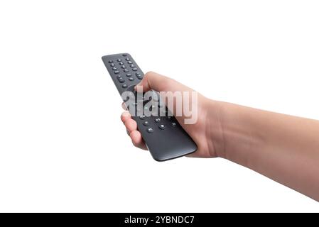 Die Hand hält eine TV-Fernbedienung mit nummerierten Sendertasten und zusätzlichen Funktionstasten, isoliert auf weißem Hintergrund. Ideal für verschiedene BAS Stockfoto