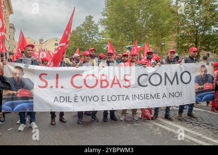 Rom, Italien. Oktober 2024. Demonstranten hinter dem Banner der SI COBAS von Como mit dem Slogan "Adil ist am Leben und kämpft zusammen mit uns" während der Demonstrationen, die sowohl von den Bewegungen für das Recht auf Wohnraum als auch von der volksunion SI COBAS organisiert wurden, die sich in einem einzigen marsch zusammengeschlossen haben, an dem etwa 7.000 Menschen teilnahmen, um gegen das Sicherheitsdekret der Regierung Meloni in Rom zu protestieren. Zahlreiche Quadrate protestierten heute in ganz Italien gegen die Reihe von Regeln des Gesetzesdekrets 1660 über die Sicherheit, das im parlament von der Regierung Meloni verabschiedet wurde und demnächst auch sein wird Stockfoto