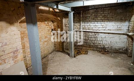 Reconstruction of an old building's basement with metal supports reinforcing the ceiling. Stockfoto