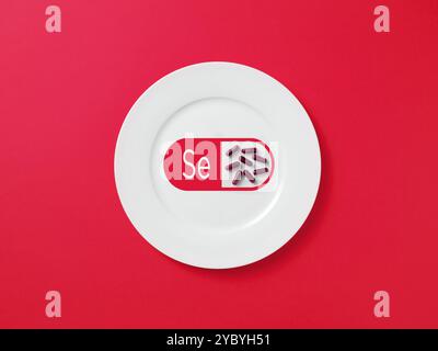 Platte mit einem medizinischen Kapselpillen Symbol gefüllt mit Selen Ergänzungen, symbolisiert die Bedeutung von Nahrungsergänzungsmitteln Stockfoto