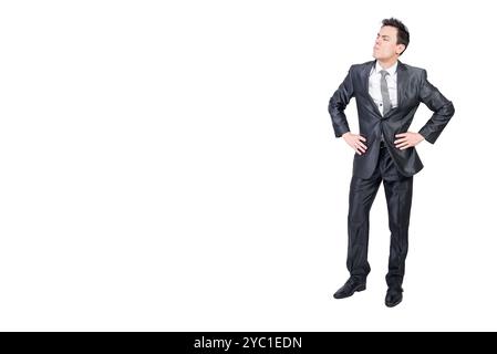Aufmerksamer, männlicher Manager, der im Studio steht und wegschaut Stockfoto