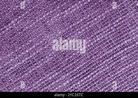 Polster in violettem Jacquard-Gewebe mit grober Webstruktur. Textilhintergrund, Möbel Textilmaterial, Tapete, Hintergrund. Stoffstru Stockfoto