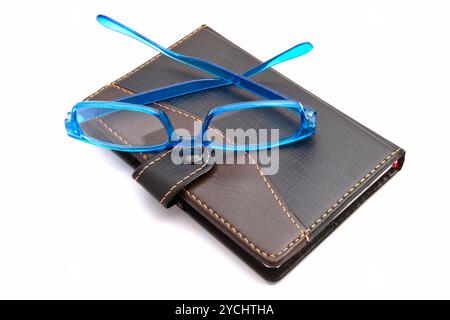 Notebook und Brille Stockfoto