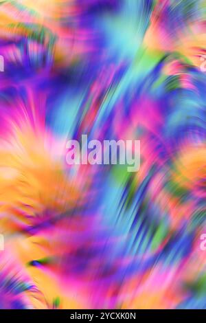 Ein lebendiges und dynamisches abstraktes, unscharfes Bild mit einer Mischung aus leuchtenden Rosa-, Blau-, Grün- und Gelbtönen, perfekt für lebendige Hintergrunddesigns. Stockfoto