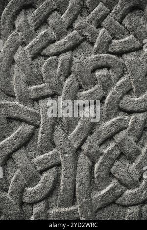 Zusammenfassung Hintergrund Detail einer keltischen Knoten Muster in Stein Stockfoto