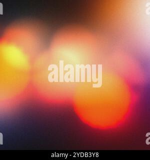 Körniger abstrakter Hintergrund mit unscharfen Lichtern in warmen Farben Stockfoto