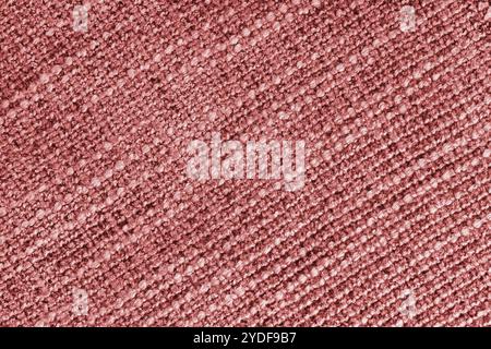 Rote Polsterung aus Jacquard-Stoff mit grober Webstruktur. Textilhintergrund, Möbel Textilmaterial, Tapete, Hintergrund. Stoffstruktur Stockfoto