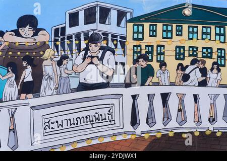 Ein Wandgemälde in der Klong Ong Ang Walking Street in Chinatown/Pahurat in Bangkok, Thailand, das junge Thailänder über die Phanuphan Bridge zeigt Stockfoto