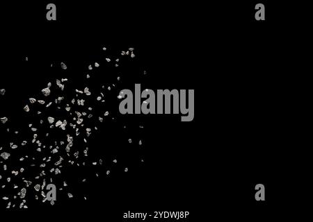 Zersplitterter Steinschutt explodiert vor schwarzem Hintergrund Stockfoto