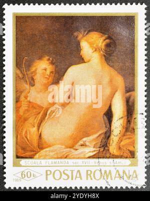 Gestempelte Briefmarke, gedruckt von Rumänien, auf der das Gemälde Venus und Cupid, Flämische Schule, um 1969 zu sehen ist. Stockfoto