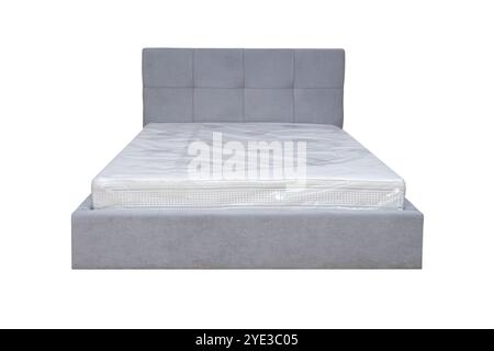 Doppelbett mit weichem Kopfteil. Gepolsterte Möbel. Stockfoto