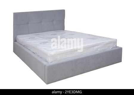 Doppelbett mit weichem Kopfteil. Gepolsterte Möbel. Stockfoto
