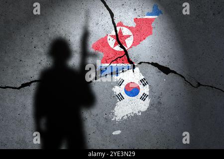 Flaggen Nordkoreas und Südkoreas auf die Betonmauer gemalt mit Soldatenschatten Stockfoto