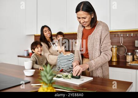 Eine glückliche Familie versammelt sich in ihrer modernen Küche, bereitet festliche Leckereien zu, während sie die Gesellschaft des anderen genießt. Stockfoto