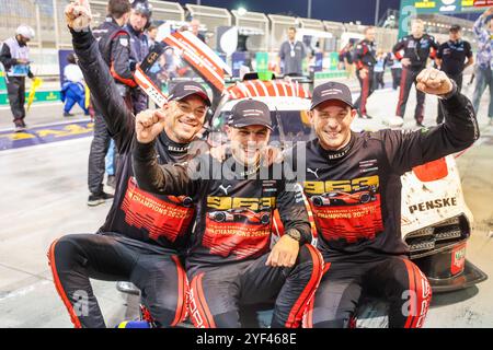 Sakhir, Bahrain. November 2024. (Von L bis R) Andre Lotterer, Laurens Vanthoor und Kevin Estre feiern nach dem 8-stündigen Rennen in Bahrain, Runde 8 der FIA World Endurance Drivers' Championship 2024 auf dem Bahrain International Circuit (BIC) in Sakhir, Bahrain, 2. November 2024. Quelle: Qian Jun/Xinhua/Alamy Live News Stockfoto