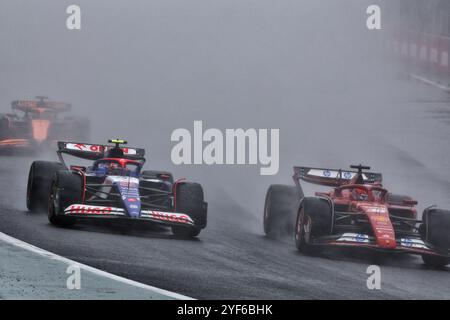 Sao Paulo, Brasilien. November 2024. Yuki Tsunoda (JPN) RB VCARB 01 und Charles Leclerc (MON) Ferrari SF-24 kämpfen um die Position. 03.11.2024. Formel-1-Weltmeisterschaft, Rd 21, Großer Preis Brasiliens, Sao Paulo, Brasilien, Wettkampftag. Das Foto sollte lauten: XPB/Alamy Live News. Stockfoto