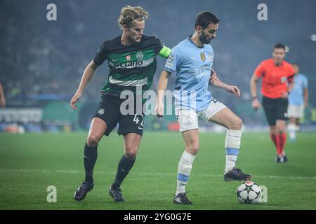 Lissabon, Portugal, Portugal. November 2024. Morten HJULMAND von Sporting und Bernardo SILVA von Manchester City während der UEFA Champions League, League Phase MD4 Spiel zwischen Sporting CP und Manchester City am 5. November 2024 in Lissabon, Portugal. (Kreditbild: © Matthieu Mirville/ZUMA Press Wire) NUR REDAKTIONELLE VERWENDUNG! Nicht für kommerzielle ZWECKE! Stockfoto