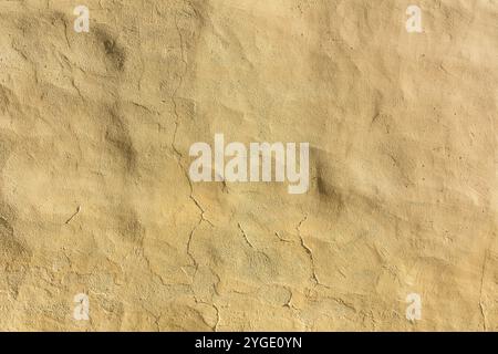 Hintergrund gelb, beige verputzte Wand Stockfoto
