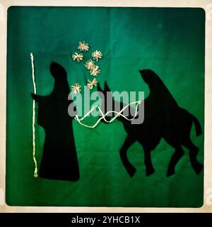 A banner with the embroidered figures of Saint Joseph and the Virgin Mary riding a donkey in their travel to Egypt decorates the Santa Rosa de Lima church in Condesa neighborhood, Stock Photo