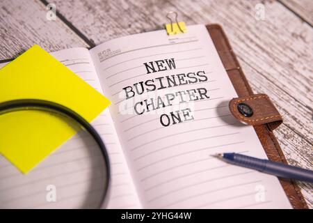 Wirtschaftsdiagramme und die Inschrift New Business Chapter 1 Stockfoto