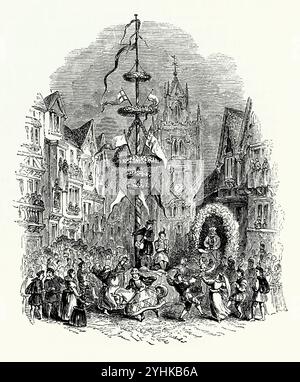 Ein alter Gravur eines beeindruckenden Maypols in der St. Mary Axe in der City of London, England, Großbritannien mit der Kirche St. Andrew Undershaft im Hintergrund. Tänzer und Musiker stehen an der Basis. Die Maiole ist eine hohe Holzstange, die im Rahmen verschiedener europäischer Volksfeste errichtet wird, um die oft ein Maipolentanz stattfindet. Der Maitag ist ein alter Feiertag, der in der Regel am 1. Mai oder am ersten Montag im Mai gefeiert wird. Stockfoto