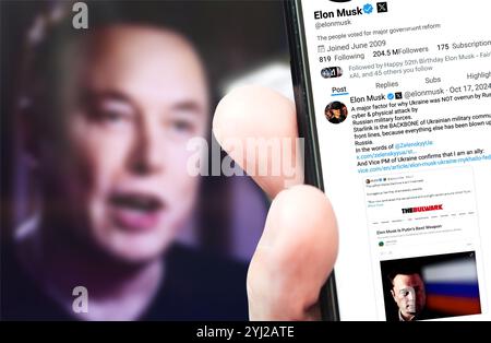 Poltava, Ukraine - 1. November 2024 Elon Musk Twitter-Profilseite auf einem Smartphone-Bildschirm mit einem neuen Tweet. Im Hintergrund ist ein verschwommenes Porträt zu sehen Stockfoto