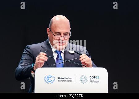 Baku, Aserbaidschan, 13. November 2024. Michail Mischustin, Premierminister der Russischen Föderation, spricht während des ersten Teils des hochrangigen Segments der Klimakonferenz der Vereinten Nationen im Plenarsaal von Nizami während der COP29, einer Veranstaltung des UNFCCC im Olympiastadion von Baku. Die COP29, die ab November 11-22 läuft, konzentriert sich auf den CO2-Ausgleich sowie die Finanzierung von Nachhaltigkeit und Klimaschutz. Quelle: Dominika Zarzycka/Alamy Live News. Stockfoto