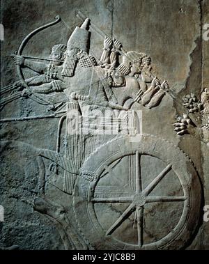 Assyrisches Relief aus dem Palast in Ninive 650 v. Chr. König Assurbanipal auf seinem Wagen. MUSEUM: BRITISH MUSEUM, LONDRES, UK. Stockfoto