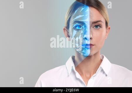 Gesichtserkennungssystem. Frau, die sich einer biometrischen Verifizierung auf grauem Hintergrund unterzieht Stockfoto