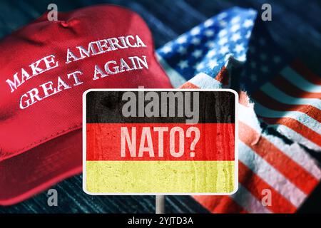 FOTOMONTAGE, Schild mit Deutschlandfahne und Aufschrift NATO vor gerissener US-Fahne und Trump-Mütze *** FOTOMONTAGE, Schild mit deutscher Flagge und Aufschrift NATO vor gerissener US-Flagge und Trump-Kappe Stockfoto