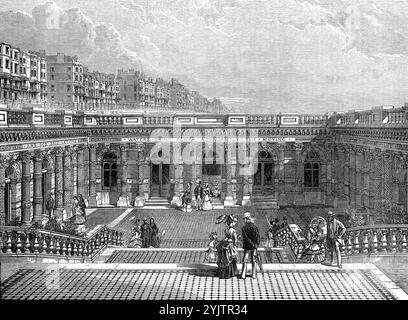 Eingangsgericht des Brighton Aquariums, [Brighton, Sussex], 1872. "Dieses establishment...promises, um eine große Hilfe für das populäre Studium eines interessanten Zweiges der Zoologie zu sein und die Liegen am Meer mit konstanten Mitteln der rationellen Unterhaltung zu versorgen... der Ingenieur war Herr Eugenius Birch... der Architekt war Herr [J. S.] Nachtigall... drei breite Flügel von Granitstufen...[führen zum] Eingangsbereich... der Stil der Architektur ist Composite... die Vorderseite des Gebäudes besteht aus fünf Rundbögen, die durch gekoppelte Terrakotta-Säulen miteinander verbunden und gestützt sind Stockfoto