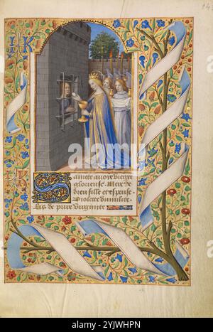 Die heilige Avia im Gefängnis empfängt Kommunion von der Jungfrau; Katherine Hours, ca. 1480-1485. Weitere Informationen: Eine Version der Legende von der Jungfrau und Märtyrerin Avia erzählt, dass die heilige, die wegen ihres christlichen Glaubens inhaftiert war, auf wundersame Weise die Kommunion von der Jungfrau Maria empfing. In dieser Miniatur erscheint die gekrönte Jungfrau mit einem Gefolge von anbetenden Engeln, die liturgische Gegenstände tragen, darunter einen Räucherhalter und ein Prozessionskreuz. Die Jungfrau selbst bietet den Wirt an und hält den Kelch. In diesem Stundenbuch begleitet die Miniatur ein Fürbittergebet Stockfoto