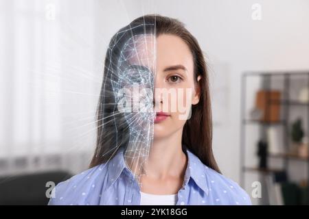 Gesichtserkennungssystem. Frau, die sich zu Hause einer biometrischen Verifizierung unterzieht Stockfoto