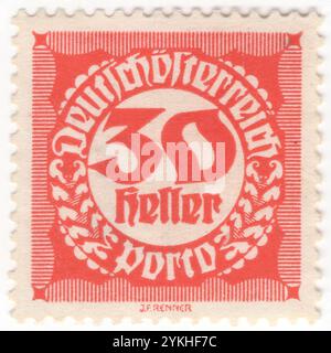 ÖSTERREICH — 1920: 25 heller roter Briefmarken mit einer Wertzahl in einem kreisförmigen Rahmen mit geometrischem Ornament im Stil des Blackletters, auch als gotische Schrift, gotischer Minuskel oder gotischer Typ bekannt, war eine Schrift, die in Westeuropa verwendet wurde. Neben der italienischen Schrift und der römischen Schrift war der Schwarze Buchstabe eine der wichtigsten Schriften in der Geschichte der westlichen Typografie. Fragen der Republik Stockfoto