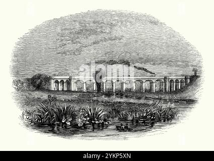 Ein alter Kupferstich des Brandon Viaduct (oder Wolston Viaduct oder Avon Viaduct), Warwickshire, England, UK um 1700 – stammt aus einem viktorianischen Geschichtsbuch. Es ist ein Eisenbahnviadukt, das den Fluss Avon zwischen den Dörfern Brandon und Wolston überquert, etwa auf halbem Weg zwischen Rugby und Coventry. Die Brücke wurde um 1835 für die London and Birmingham Railway gebaut. Er überquert den Fluss Avon und seine Hochwasserebene mit 15 Bögen aus Backstein, die aber mit Sandstein bedeckt sind. Stockfoto