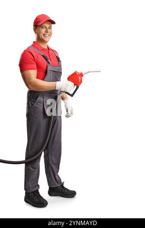 Gasjockey in Uniform mit einem Tankschlauch isoliert auf weißem Hintergrund Stockfoto