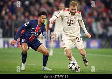 MÜNCHEN – 26. NOVEMBER: Konrad Laimer von Bayern München streitet mit Warren Zaire Emery vom FC Paris Saint Germainwährend des Spiels der UEFA Champions League 2024/25 League Phase MD5 zwischen dem FC Bayern München und Paris Saint-Germain am 26. November 2024 in München. © diebilderwelt / Alamy Stock Stockfoto