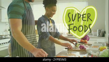 Bild von Super-Food-Text über diversen Paaren, die gesunde Mahlzeit in der Küche vorbereiten Stockfoto