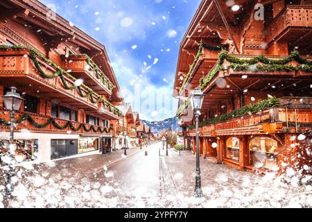 Idyllisches Alpendorf Gstaad mit schneebedecktem Blick auf die Straße, luxuriöses Winterziel in der Schweiz Stockfoto