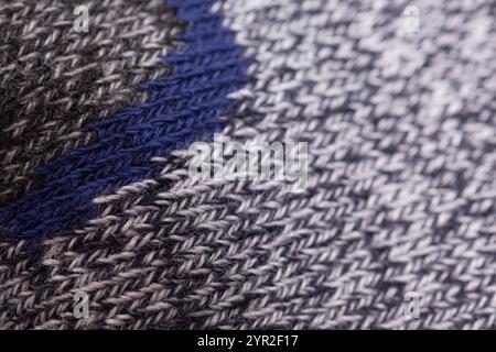 Gestrickter grauer Texturhintergrund aus Wolle Stockfoto