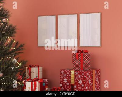 Dreirahmiges Modell an der farbenfrohen Wand im weihnachtlichen Wohnzimmerdekor mit Weihnachtsbaum und Geschenkboxen. 3 leeres Poster-Modell, Galerie-Wandkunst. Stockfoto