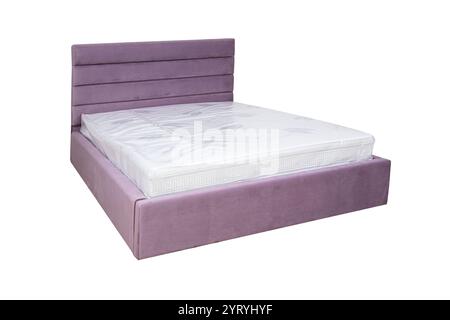 Doppelbett mit weichem Kopfteil. Gepolsterte Möbel. Stockfoto