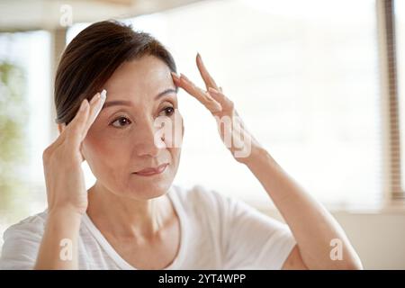 Haut schöne Frau mittleren Alters Stockfoto