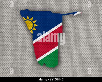 Karte und Flagge von Namibia auf alten Leinen Stockfoto
