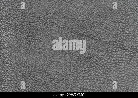 Dunkelgraues abstraktes Kunstledermuster für Hintergrund. Nahaufnahme von Draufsicht von Schatten, hellschwarz, künstlich, oberflächlich Stockfoto