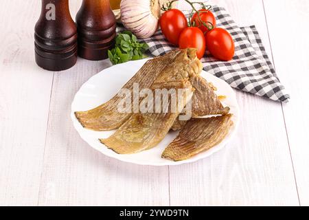 Gebackene Stachelrochen mit Öl und Gewürzen Stockfoto